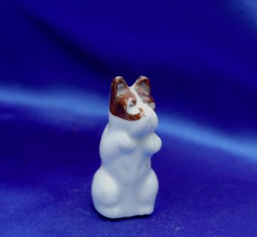 Vintage porcelain dog and so talented Â  Â sitting Â up begging 